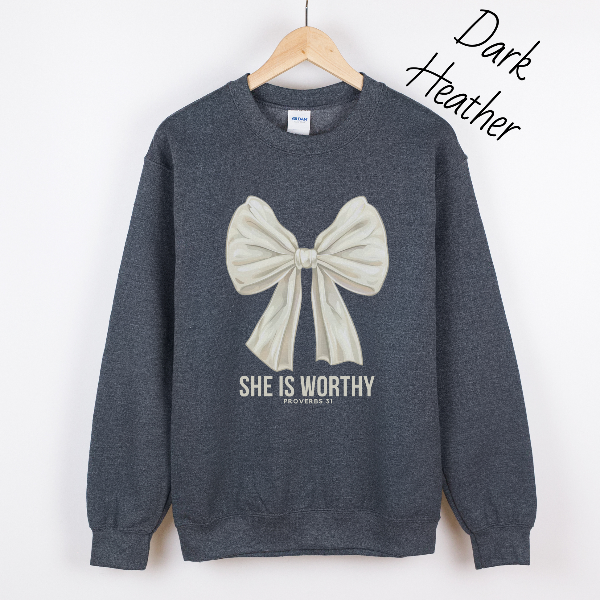 Large white bow with the words "She is Worthy Proverbs 31" on a dark grey sweatshirt.